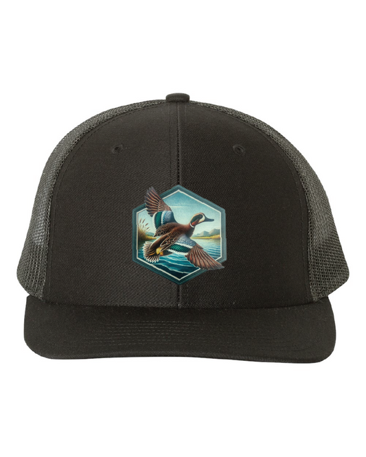 Green Wing Teal Hexagon Patch on a Richardson 112 Trucker Hat