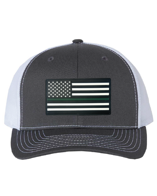 USA Flag Green Line PVC Patch on a Richardson 112 Trucker Hat