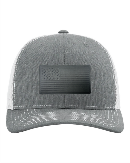 USA Flag Black PVC Patch on a Richardson 112 Trucker Hat